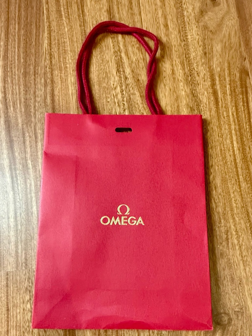 Omega Red Gift Bag with Gold Logo and Rope Handles